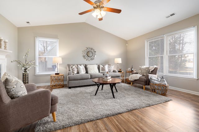 Furnished living room with hardwood flooring